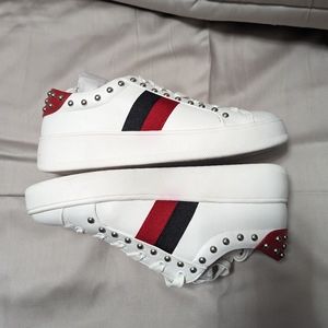 Stylish White Sneakers with Red and Black Stripes